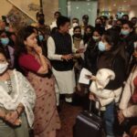 Union Minister Piyush Goyal receives the first batch of home bound Indians from Ukraine  at the Mumbai International Airport.